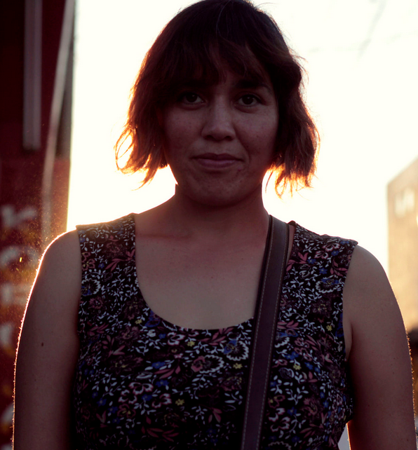 Girl standing in a city